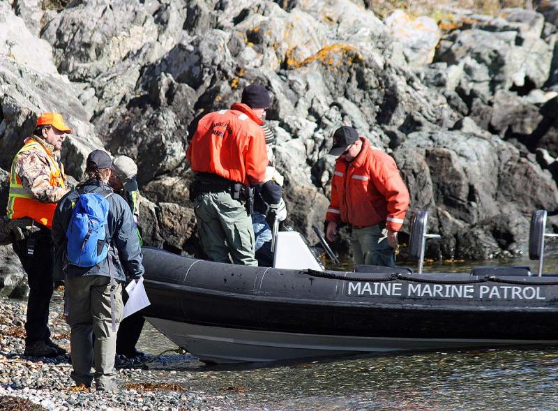 Some of the 'victims' in Saturday's exercise are transported off the beach back to Rockland via Maine Marine Patrol boat. (Photo by Holly S. Edwards)