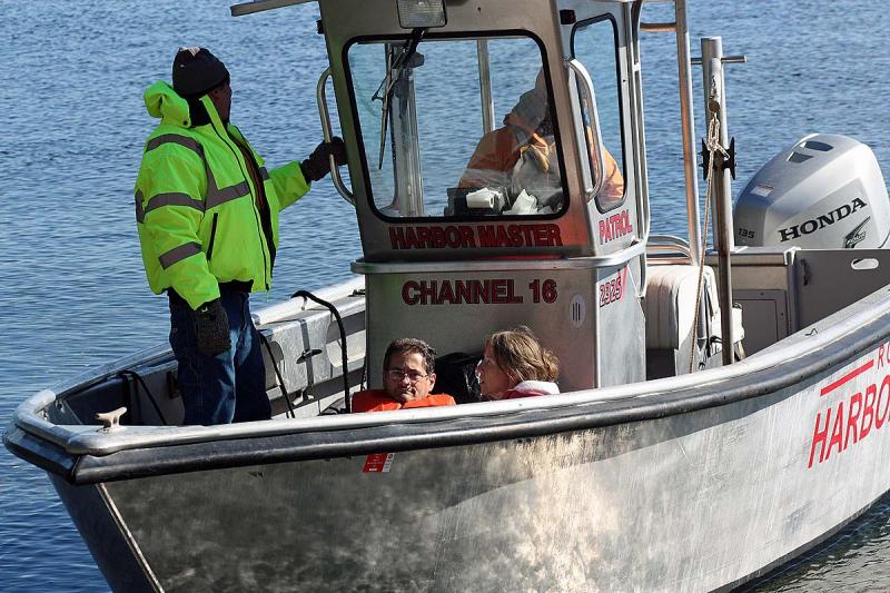 Other 'victims' are rescued off the beach at Lasell Island via the Rockport Harbormaster's boat. (Photo by Holly S. Edwards)