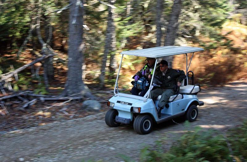 While it appears this vehicle is whizzing through the woods, it's just an illusion like much of the day's activites on Lasell Island, Oct. 13. (Photo by Holly S. Edwards)