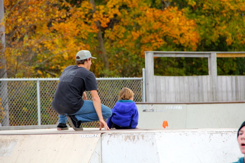 Skater Max Press and son Arlo watch the warmup.