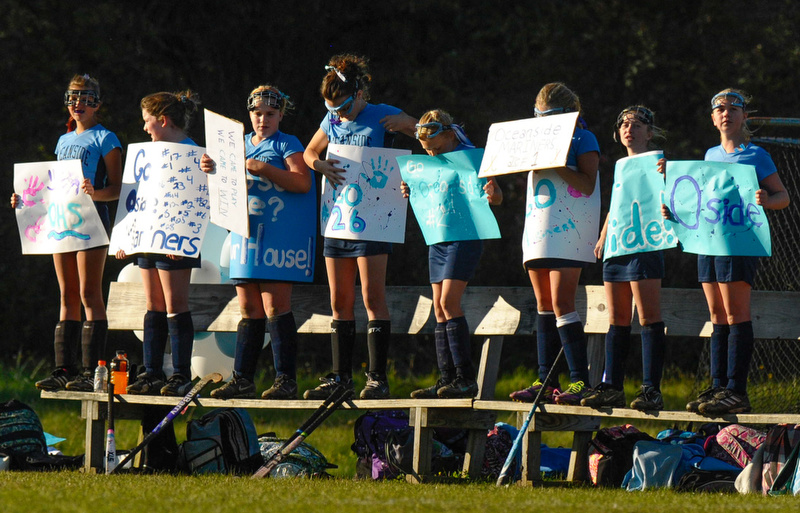 Oceanside reserves show support for their teammates during the game. (Photo by Ron Hawkes)