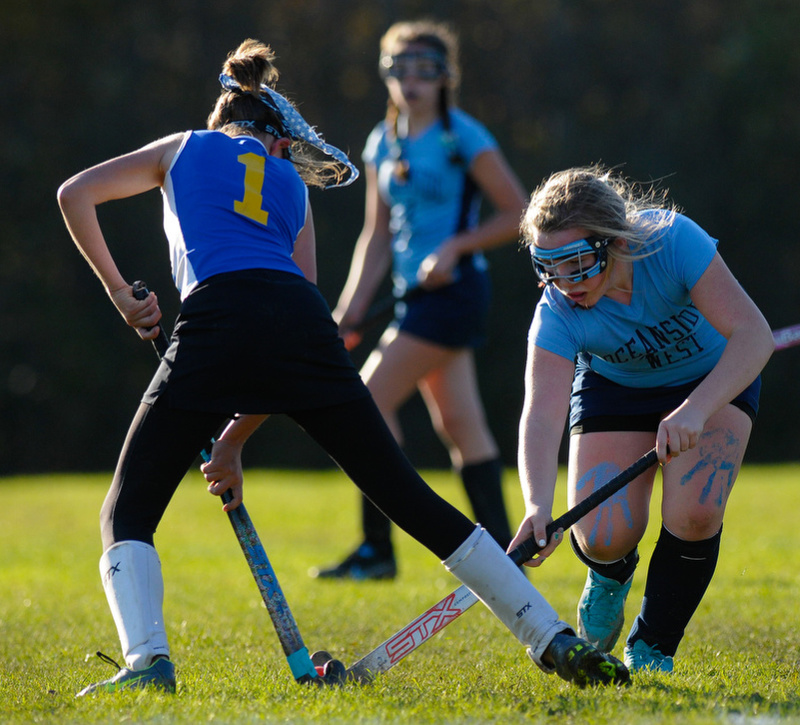 Troy Howard's Victoria Curtis stops Oceanside's Taylor Hamill as she tries to advance the ball. (Photo by Ron Hawkes)