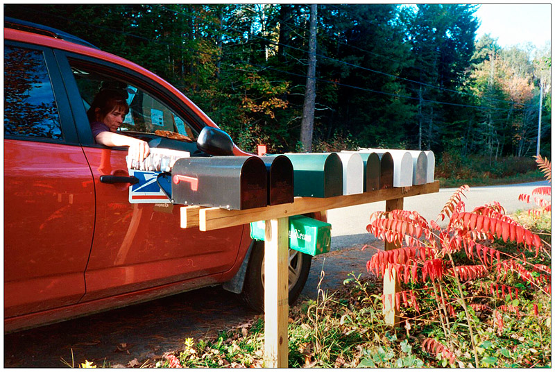 BELFAST – Renee Lord delivers mail to the Belfast Cohousing Ecovillage, where nine families have moved in and construction continues. The planned 36-unit development is slated to include a Common House with a mailroom to replace the roadside boxes.