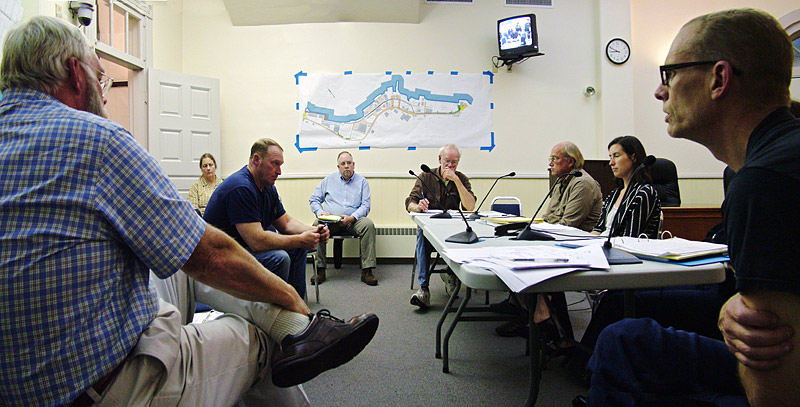 Members of RSU 20 withdrawal committees from several towns joined the Belfast committee Oct. 4 to review preliminary financial estimates for a post-RSU 20 school district. Among those pictures are, from right, Belfast City Councilor Eric Sanders, Belfast attorney Kristin Collins, Belfast committee member Steve Hutchings, RSU 20 board member Tony Swebilius of Morrill, Northport selectman Paul Rooney and Morrill selectman Randy Place. At far left, former RSU 20 superintendent Bruce Mailloux. (Photo by Ethan Andrews)