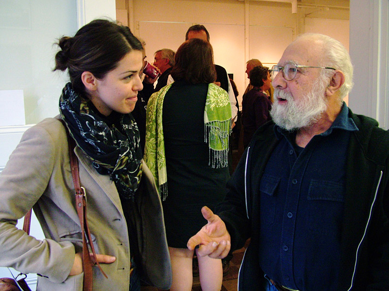 Generations of the creative economy: Artists Susan Dansereau and Joe Ascrizzi talk after a presentation by the Maine Arts Commission's new director Julie Richard at Waterfall Arts, Oct. 31. Dansereau moved to Belfast from Rhode Island in July. Ascrizzi, of Freedom, moved here from Connecticut in 1971. (Photo by Ethan Andrews)
