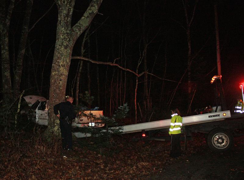 Camden Exxon begins removing the truck from the accident scene on outer Washington Street (Route 105) in Camden Friday. (Photo by Holly S. Edwards)
