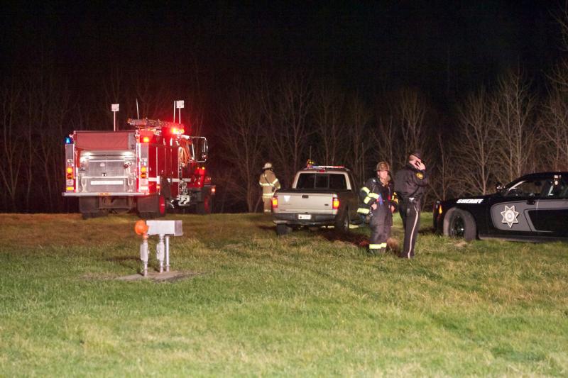 Knox County Chief Deputy Tim Carroll on the phone at the scene of Friday night's plane crash in Owls Head. (Photo courtesy Steve Waterman)