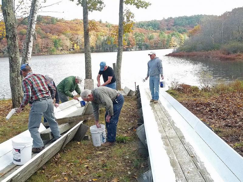 West Bay Rotarians at work refurbishing the Camden Snow Bowl's toboggan chute Oct. 26. (Photo courtesy Sandy Cox)