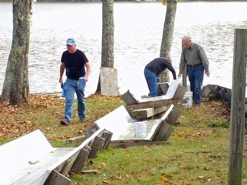 West Bay Rotarians at work refurbishing the Camden Snow Bowl's toboggan chute Oct. 26. (Photo courtesy Sandy Cox)