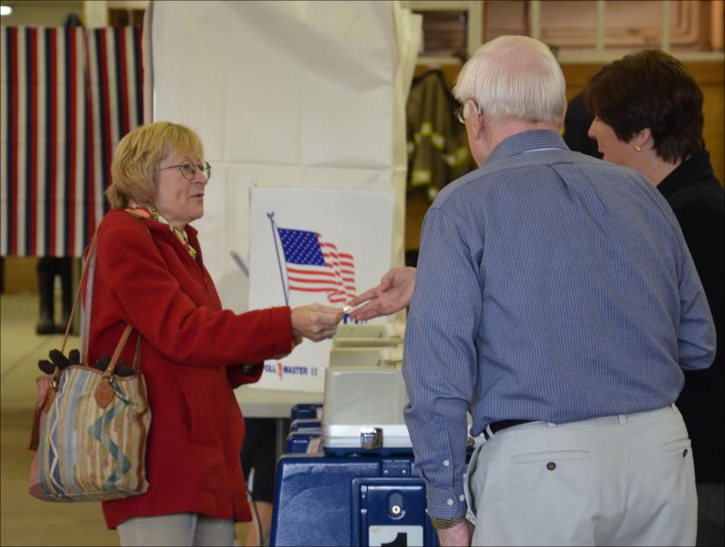 Camden resident Elyse Socker got her "I voted today" sticker from Town Clerk Katrina Oakes. Elyse' son, Eddie, voted for the first time in his life this morning, having turned 18 this year.