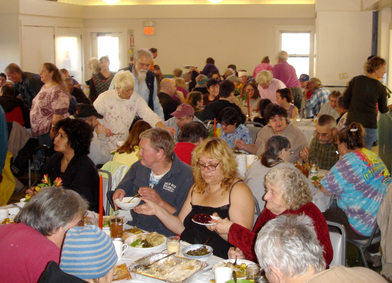Hungry diners dig into the feast. (Photo by Chris Wolf)