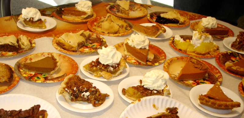 A table of dessert pies.
