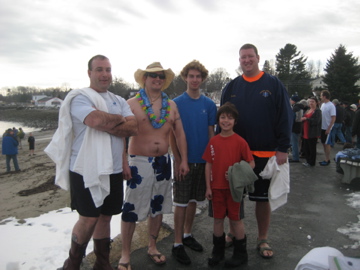 Justin Hills, right, participating in a Dip for Derek fundraiser at Lincolnville Beach.