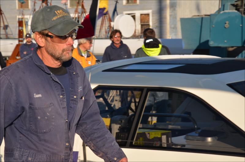 Sam Smith, of Lyman Morse, coordinates the boat's entry into the river.