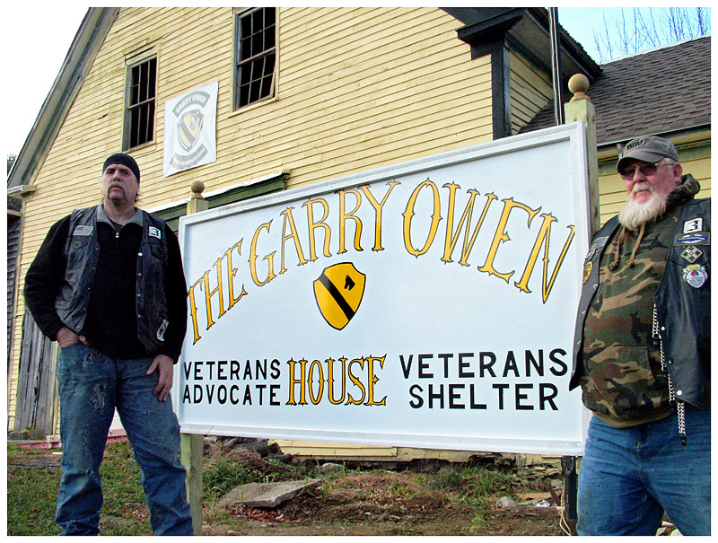 George Biagiotti, left, and Dwayne Keller, members of the Garry Owen Motorcycle Club, outside the new Garry Owen House. (Photo by Ethan Andrews)