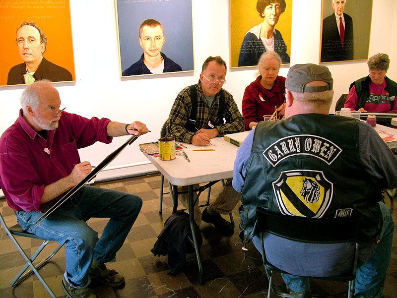 Vietnam War veteran Dwayne Keller, foreground, of Liberty, sits for portraits by artists, from left, Robert Shetterly, Kenny Cole and Charlene Decker during an Armistice/Veterans Day draw-a-thon at Waterfall Arts in Belfast (Photo by Ethan Andrews) Dwayne Keller, foreground, a Vietnam War veteran, sits for portraits by artists, from left, Robert Shetterly, Kenny Cole and Charlene Decker during an Armistice/Veterans Day draw-a-thon.