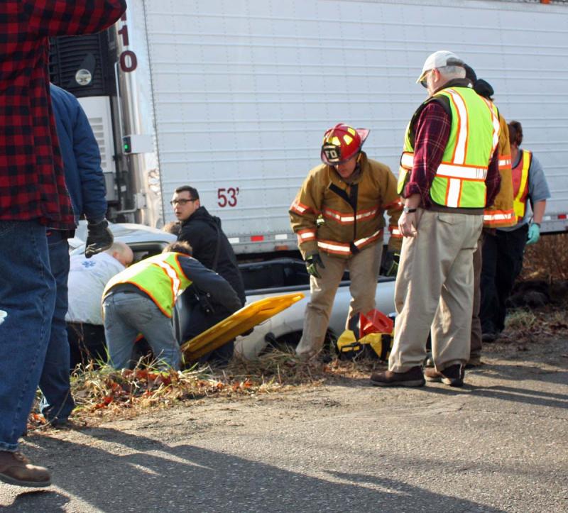 Crews prepare to remove Floyd Hews of Searmont from his pickup truck after an accident in Rockport late Sunday morning. (Photo by Holly S. Edwards)