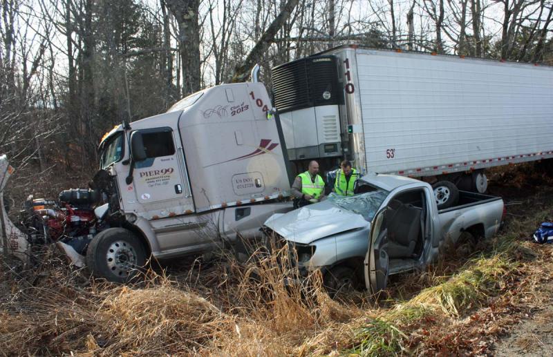 The impact of the crash split open the battery inside the engine of Floyd Hews pickup truck Sunday, according to Steve Laite of Camden Exxon. (Photo by Holly S. Edwards)
