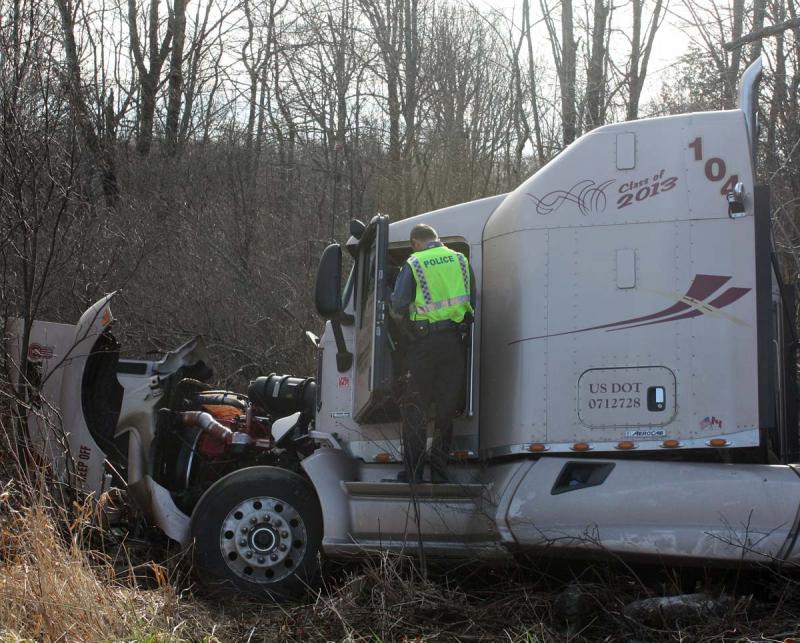 Rockport Police Officer Dana Smith talks to the driver of the tractor trailer, Ronald Goguen of New Brunswick. (Photo by Holly S. Edwards)