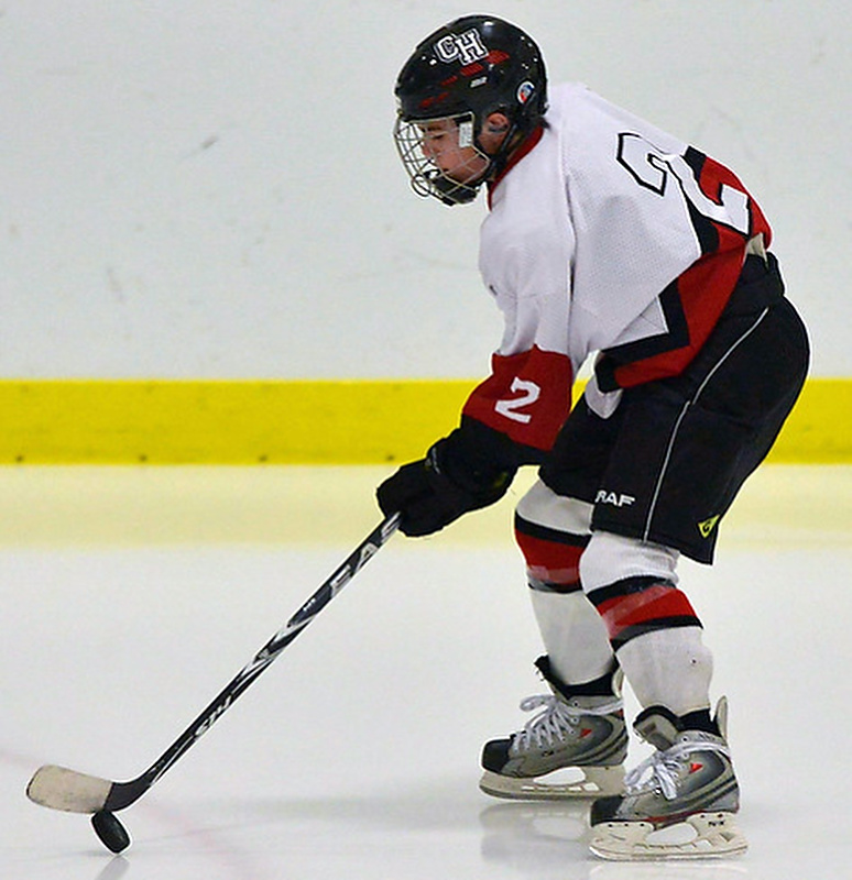 Camden Hills Nicholas Czuchra works with the puck during warmups. (Photo by Ron Hawkes)