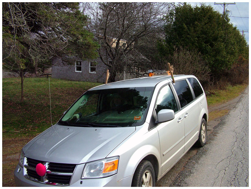 Among the unknowns of the special hunt is how easy the deer will be to find in December when they may be settling in for winter. Here, an island mail delivery car sports seasonal reindeer antlers and a red nose. (Photo by Ethan Andrews)