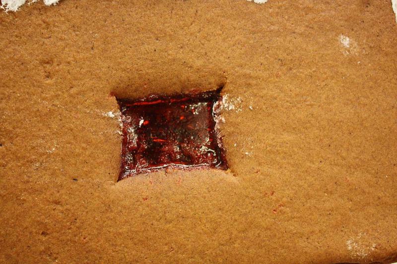 Prior to baking the gingerbread, some students dropped Jolly Rancher candies in holes cut for windows to create a stained glass effect. (Photo by Holly S. Edwards)