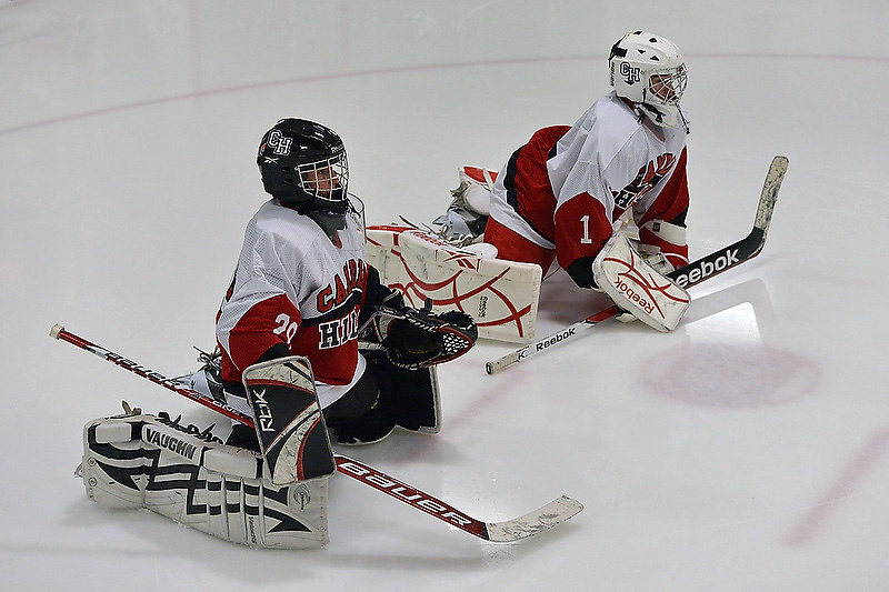 Camden Hills goalies, Zach Hand, left, and Jet Magri stretch before Saturday's contest with Hampden Academy. The Windjammers won 6-2 with Magri in goal. (Photo by Ron Hawkes)