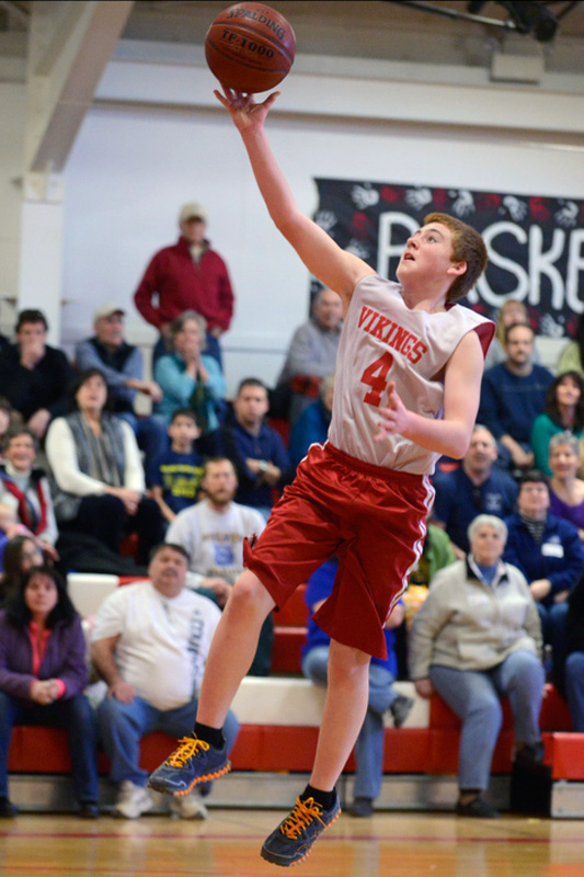 Cole Mills converts a lay up of a steal at half court. (Photo by Ron Hawkes)