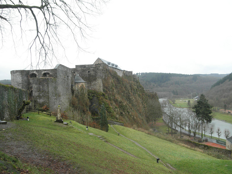 "The castle is perched on a wedge of cliff squeezed on either side by the ox-bowing Semois River."