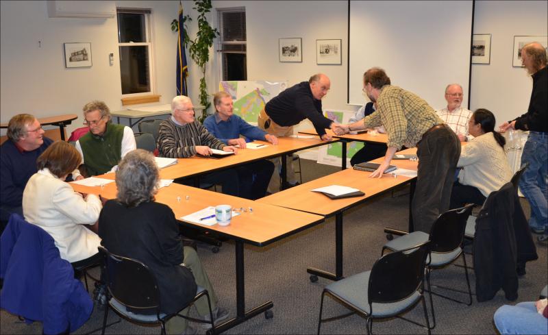 Camden and Rockport Select Boards meet and greet: Around the table, left to right: Rockport Acting Town Manager Linda Greenlaw, Camden Town Manager Patricia Finnigan, Camden Select Board members John French and Leonard Lookner, Rockport Select Board member Charlton Ames, Camden Select Board member Jim Heard leans over the table to shake the hand of Rockport Select Board member Ken McKinley. Camden and Rockport board chairmen Martin Cates and Bill Chapman are at the head of the able. To the right, Rockport Select Board member Tracy Murphy.