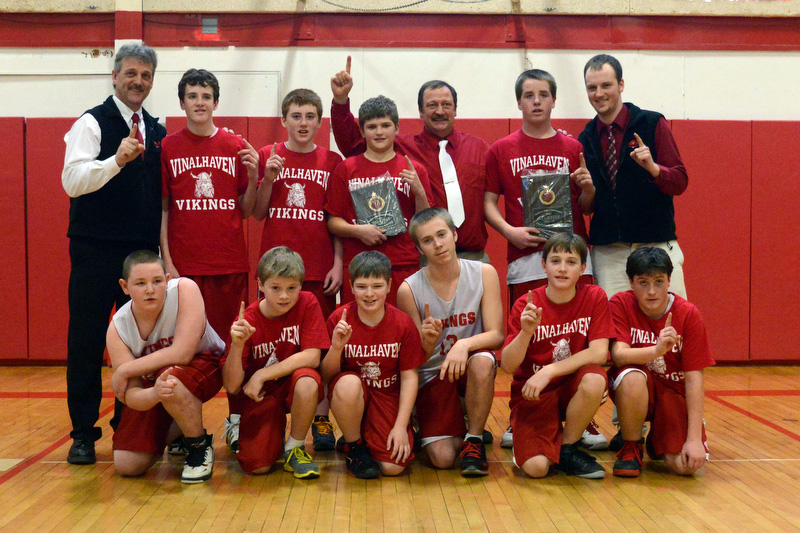 The Small School champions of Vinalhaven pose for a team photo after the game. The Vikings beat Woolwich 63-59. (Photo by Ron Hawkes)