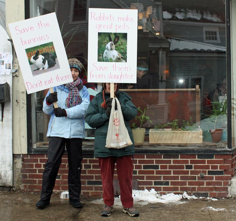 From left, Wendy Andresen and Merrill Tucker picket outside Long Grain restaurant in Camden Saturday afternoon. (Photo by Holly S. Edwards)