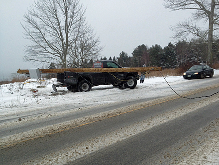Traffic stops as wires from a downed pole in Lincolville lie across the road Feb. 8. (Photo by David Edwards)