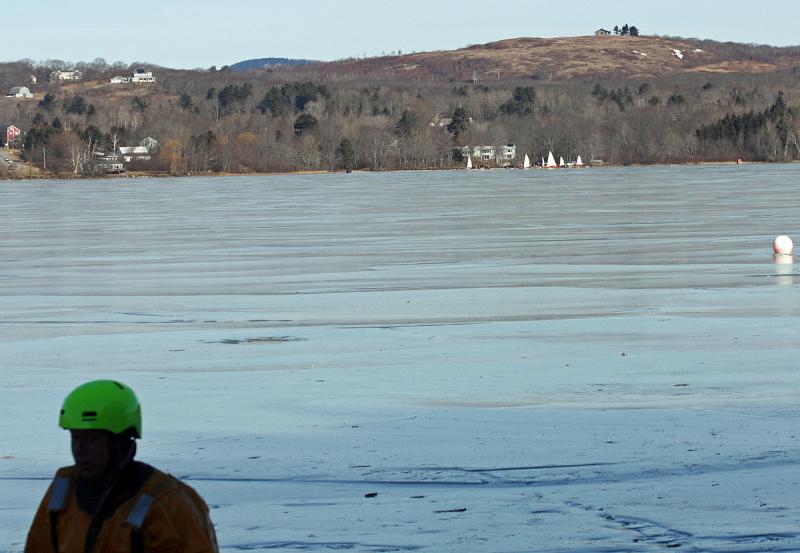 Near the end of Saturday's ice rescue training in Rockland, a flotilla of ice boats raises sails across Chickawaukie Pond. (Photo by Holly S. Edwards)