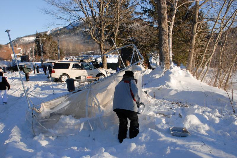 Despite losing their tent overnight, the Camden Real Estate crew rallied, dug out and set up in time to sell baked goods for Habitat for Humanity. (Courtesy Snow Bowl/by Dave Ridley)