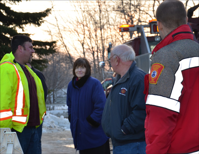 Early Saturday morning, Camden was ready to haul the loader. Tracy Harford, Town Manager Pat Finnigan, and others were on scene by 7 a.m. (Photo by Lynda Clancy)