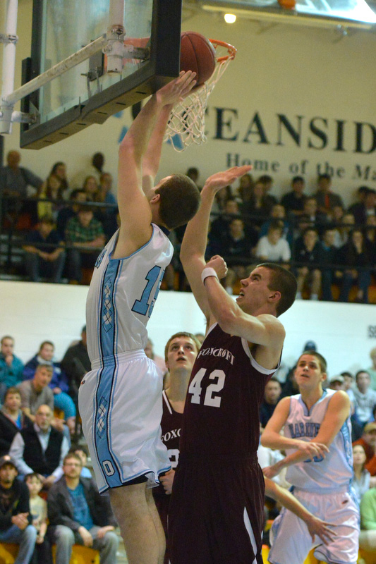 Oceanside's Tyler Gilson, left, goes up over Foxcroft Academy's Kolby Kendall during Wednesday's prelim game at Rockland. (Photo by Ron Hawkes)