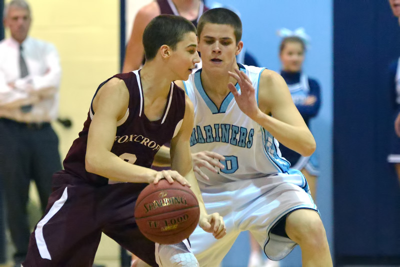 Oceanside's Shea Davenport, right, plays tough defense on Foxcroft Academy's Sean Keane. (Photo by Ron Hawkes)