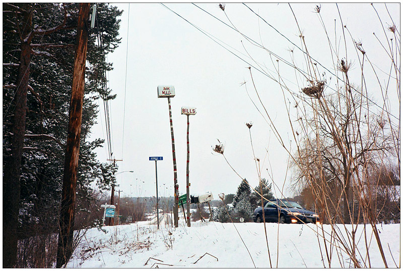 BELFAST - A pair of out-of-reach mailboxes labelled "Bills" and "Airmail" erected 30 years ago by Alden Horn, and now a familiar sight along Route 1. BELFAST - Mailboxes on tall poles labelled "Bills" and "Airmail" at the entrance to Airmail Lane, erected 30 years ago by Alden Horn. (Photo by Ethan Andrews)