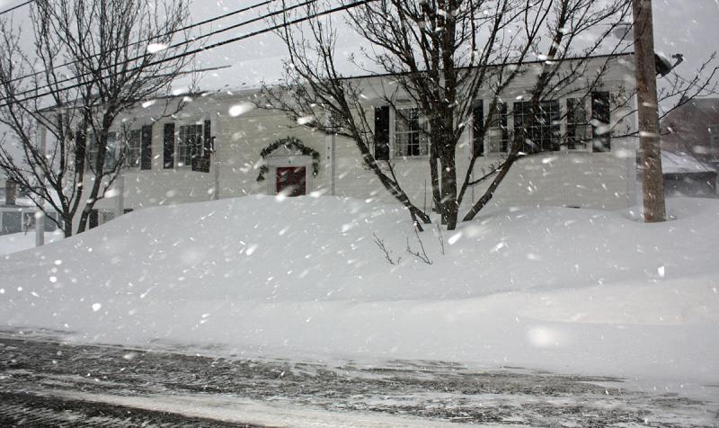 Snow flies in the camera's flash while photographing Paul Gibbons' law office. (Photo by Holly S. Edwards)(Photo by Holly S. Edwards)