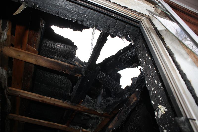 Union Fire Chief Barry Norris said the fire, caused by faulty wiring, started below this area, which burned longest and hottest and right through the roof. (Photo by Holly S. Edwards)
