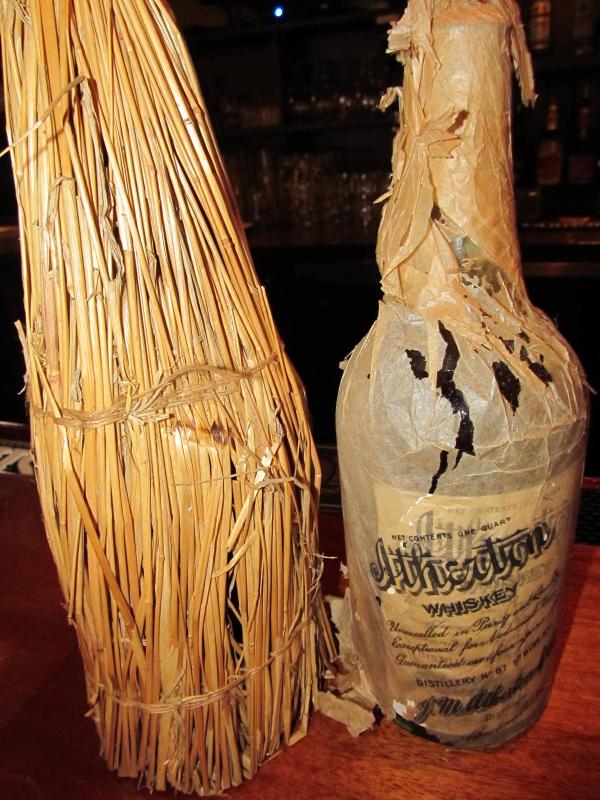 The straw encasement that shelters each bottle. (Photo by Kay Stephens)