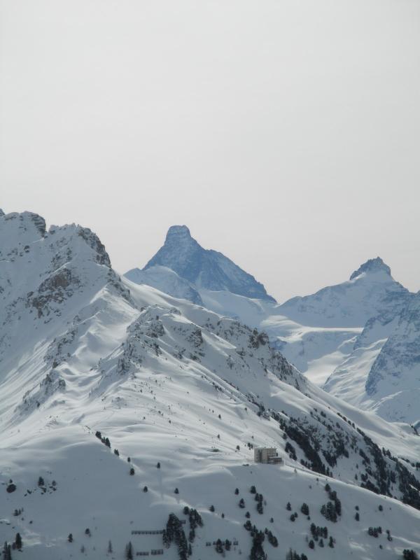 "A thick mat of somber clouds hung in the sky, but we could still see the Matterhorn, a black humpbacked fang framed between two distant peaks."