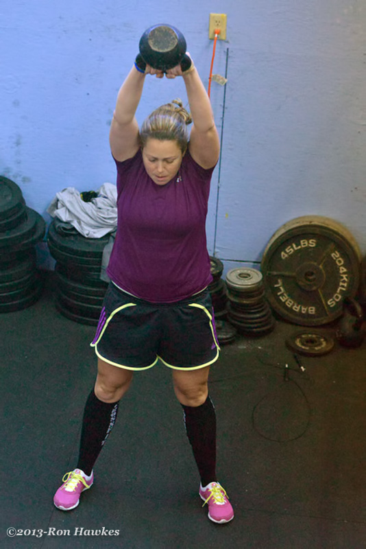 Christienne Jones swings the kettlebell. (Photo by Ron Hawkes)