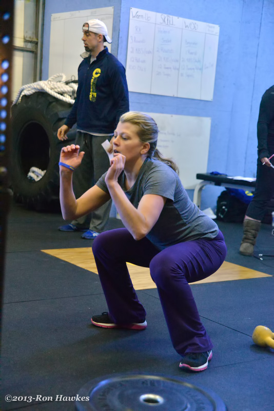 Angie Hall works on her squats during the competition. (Photo by Ron Hawkes)