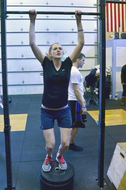 Phoebe Ferriaolo works on her jumping pull ups during the Throwdown. (Photo by Ron Hawkes)