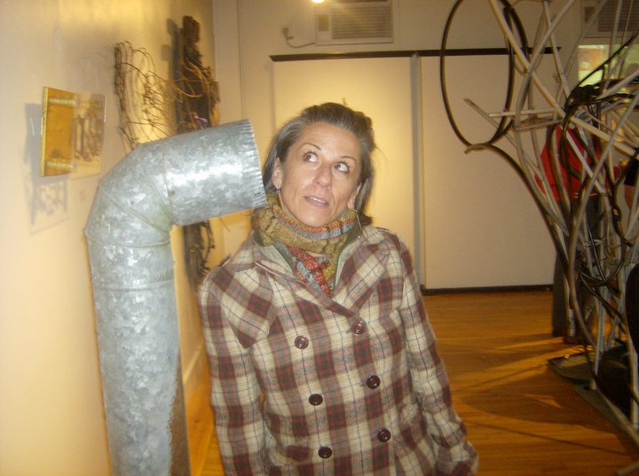 Lisa Diane listens to Bethany Engstrom's "Stand Pipe" installation at the original Resisting Entropy in 2010. (Photo by Kay Stephens)