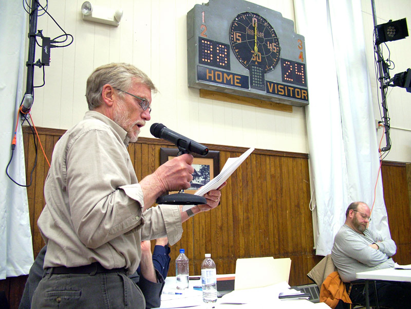 A representative of DCP Midstream, the Colorado-based company seeking to build a large propane storage and distribution terminal in Searsport, answers questions from the town's planning board Wednesday night during deliberations on project. (Photo by Ethan Andrews)