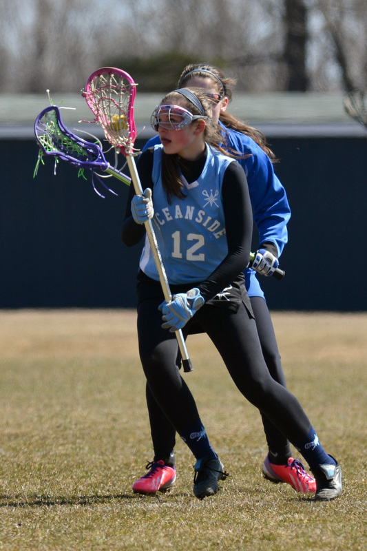 Oceanside's Brittany Rytky makes a nice move on a Lewiston defender to get around her. (Photo by Ron Hawkes)