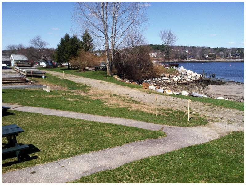 Sidewalks intersect with the old rail bed in Heritage Park. The Harbor Walk is slated to follow the rail bed through a portion of the park before turning inland to Front Street. (Photo by Ethan Andrews)